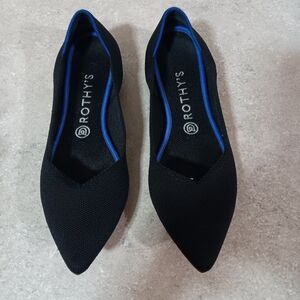 Rothy's Elegant Black Flats with Vibrant Blue Accent
